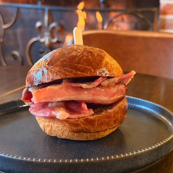 Streaky bacon brioche roll