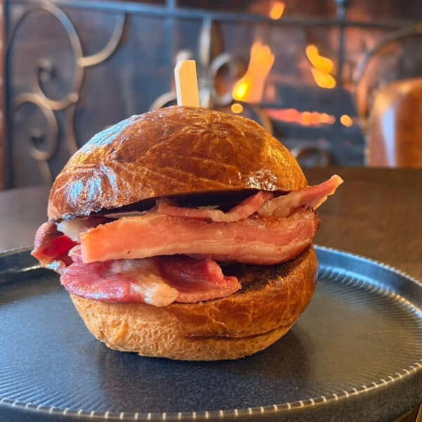 Streaky bacon & Cumberland sausage brioche roll